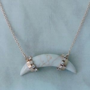 White marble horn with gold and rhinestone accents